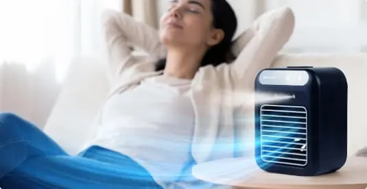 Woman relaxing with cool airflow from Glacier Breeze - perfect for outdoor use