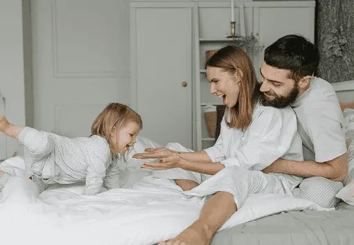 Family relaxing comfortably at home using Glacier Breeze - portable cooler in action